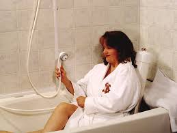 Image of woman using hand held shower