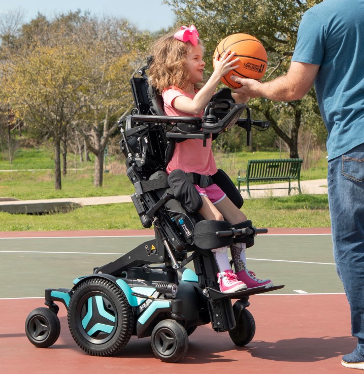 A girl uses the M Corpus VS Standing Wheelchair