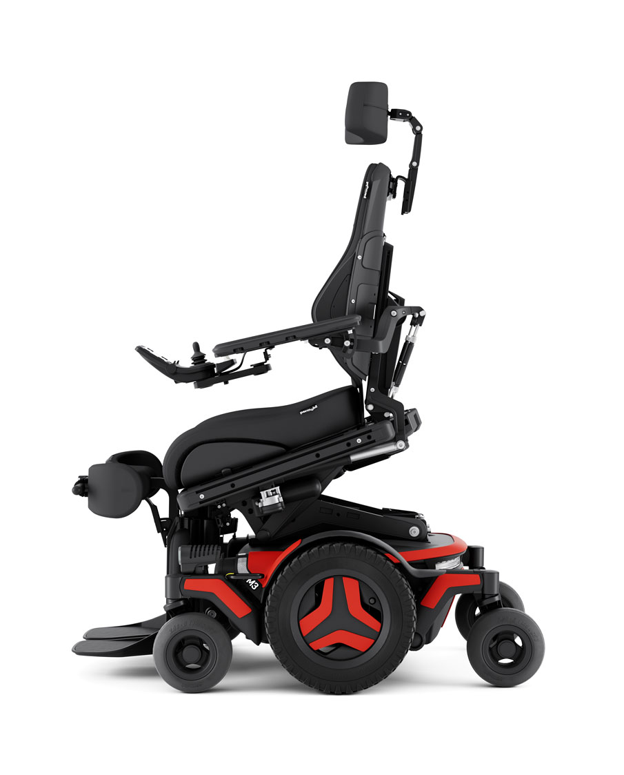 The Permobil M3 Corpus power chair with red accents is shown in the ActiveReach position - 12 inches of seat elevation combined with 20 degrees of forward tilt