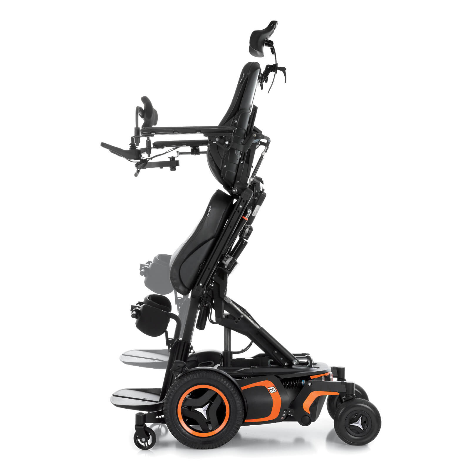 Permobil F5 Corpus VS standing wheelchair in standing postion The F5 Corpus VS standing wheelchair with orange accents is shown in the standing position. It has black rehab seating & a headrest.