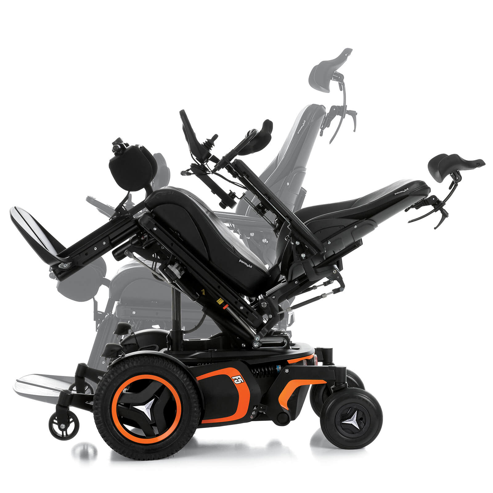 Permobil F5 Corpus VS standing wheelchair, tilted. The F5 Corpus VS standing wheelchair is shown in a tilted position. It has orange accents and black rehab seating, including a headrest.