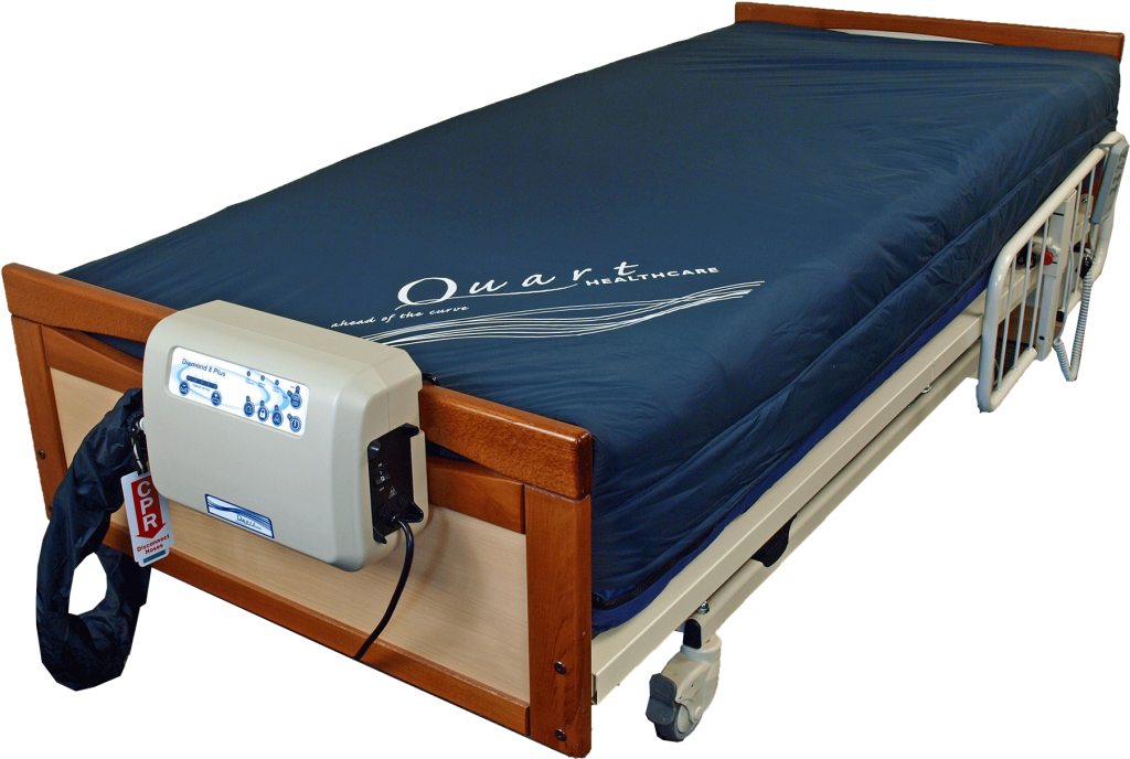 The Quart Diamond 8 Plus Low Air Loss Mattress shown on a hospital bed, attached to its air pump