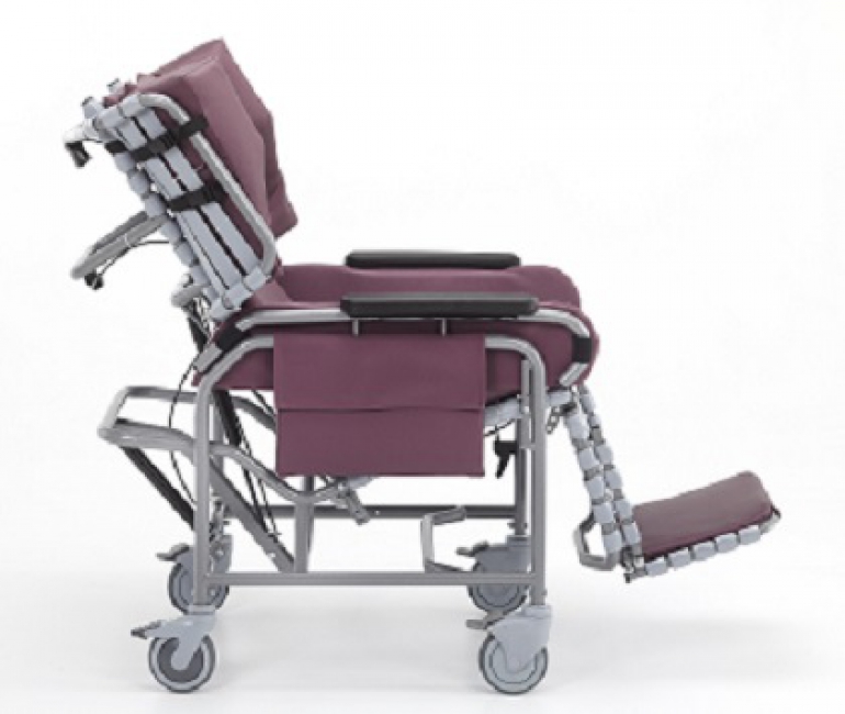 The Broda centric positioning wheelchair with burgundy padding, shown from the side.