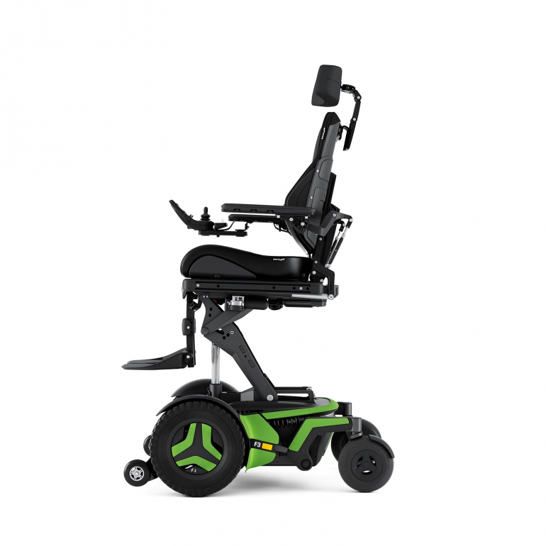 The Corpus F3 chair with bright green accents is shown from the side. It is elevated using optional ActiveHeight. It has black rehab seating and a black headrest.