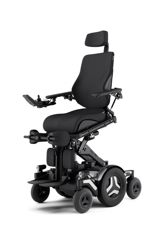 The Corpus M5 power chair with white accents and black rehab seating is shown in the ActiveReach position using a combination of elevate and forward tilt.
