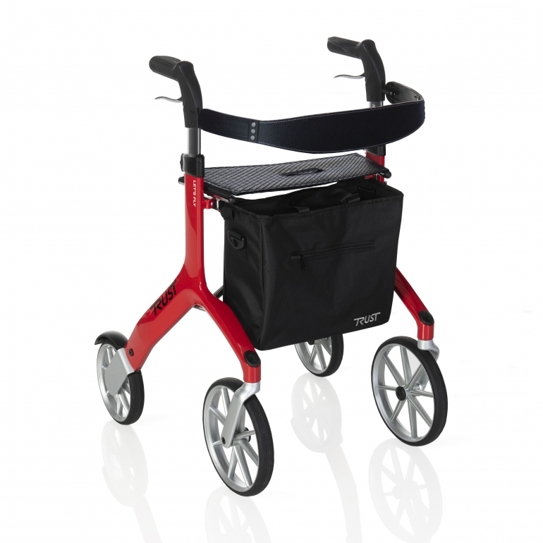 The Let's Fly Outdoor Rollator is shown at an angle, in a red colour. It has a black fabric basket attached to the front.