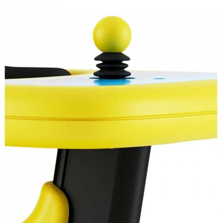 A closeup of the Permobil Explorer Mini joystick. It is a large yellow ball with a black accordion-style cover for the stem.