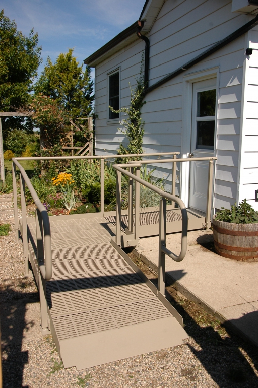 QRamp with a 90 degree bend installed leading to a white house.