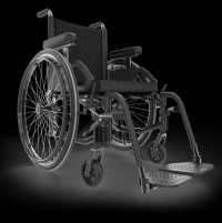 A black Move manual wheelchair sits at an angle. It has a padded backrest, spoke handrims & footrests.