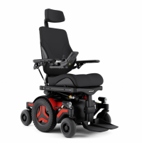 The Permobil M3 Corpus power wheelchair with red accents, shown with black rehab seating.