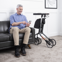 older gentlemen on couch with Lets Move Rollator thumbnail