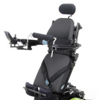 The ROVI A3 power wheelchair with green trim in the standing position with seatbelt and knee blocks. thumbnail