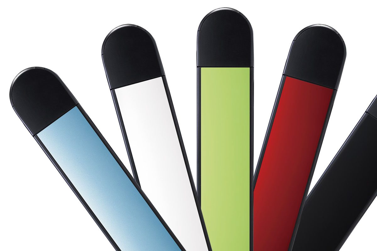 Five WHILL armrests spread out like playing cards, in light blue, white, light green, red and black.